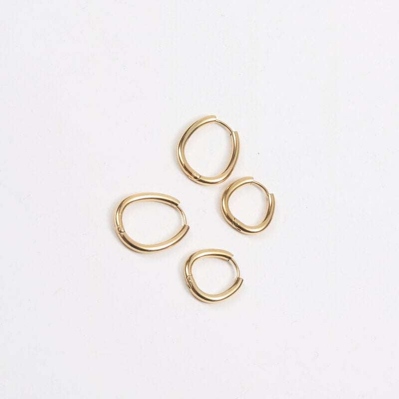 elegant jewelry essentials, titanium steel studs, trendy gold earrings - available at Sparq Mart